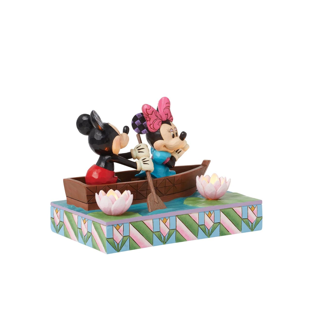 Disneys Mickey and Minnie Mouse are sailing on love in this sweet, light-up figurine from the Disney Traditions by Jim Shore.