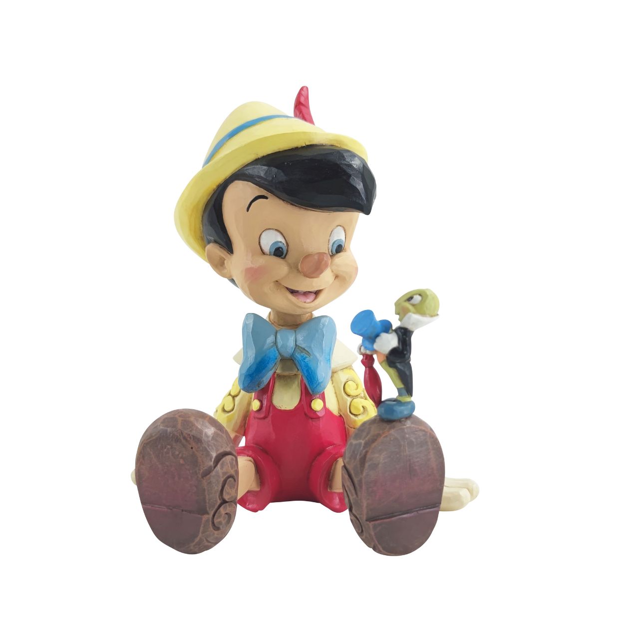 Pinocchio and Jiminy Sitting Figurine by Jim Shore  "Wishful and Wise" Jiminy Cricket is quite the dapper conscience in this design by Jim Shore, giving a tip o' his top hat as he smiles and gives his bestie Pinocchio a lesson about temptations.