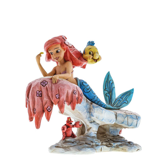 Disney's The Little Mermaid Dreaming Under The Sea Ariel  Celebrating the 25th Anniversary of Disney's The Little Mermaid, Jim Shore creates a stunning sculpture featuring Ariel, Flounder and Sebastian. Available only from the Disney Traditions brand. Made from cast stone.