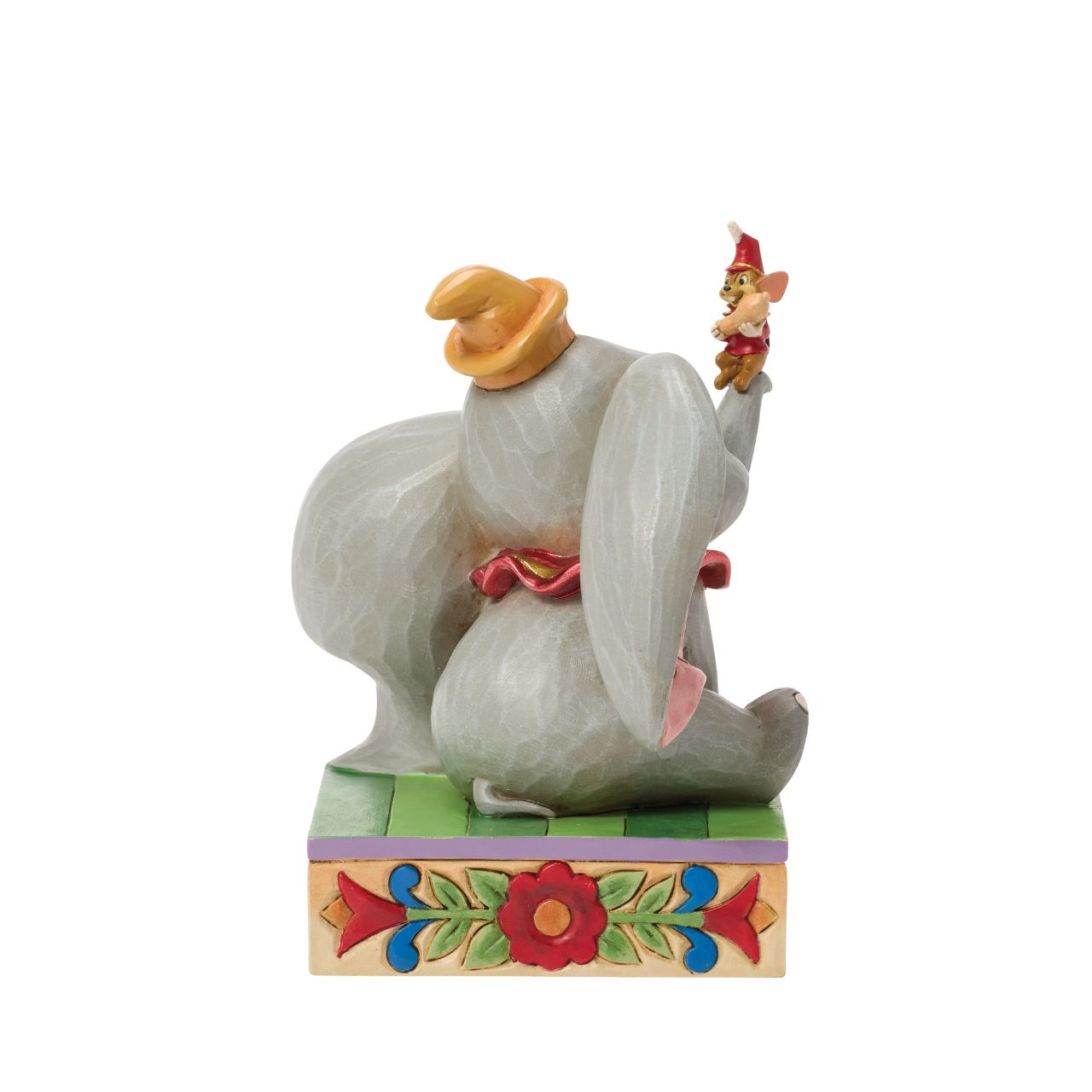 Dumbo the big eared elephant and Timothy the mouse share a joyful moment in this heartfelt Jim Shore scene.