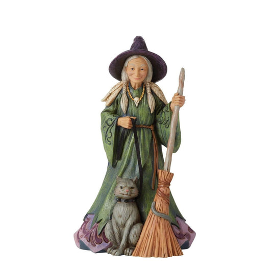 Heartwood Creek Evil Witch Figurine by Jim Shore  Handcrafted in breath-taking detail, this beautiful Evil Witch Figurine is beautifully decorated in Jim Shore's subtle combination of traditional quilt. This witch is a haughty harbinger of Halloween| She wears a ghoulish green gown fitted with a dripping haunted house scene. 