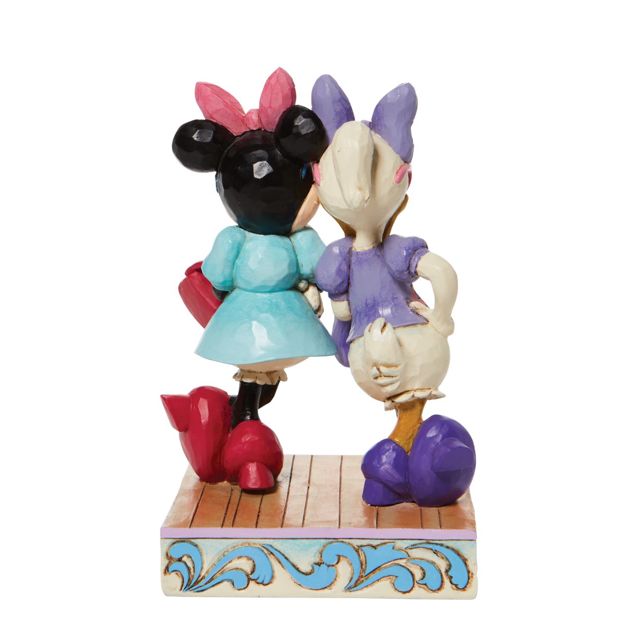 Disney "Fashionable Friends" Minnie and Daisy Figurine by Jim Shore  "Fashionable Friends" Mickey Mouse and Donald Duck would be nothing without their better and more fashionable halves! Minnie and Daisy don their finest duds to hit the town in style. Wearing shades, bows, matching purses and high heels, these ladies strike a power pose.