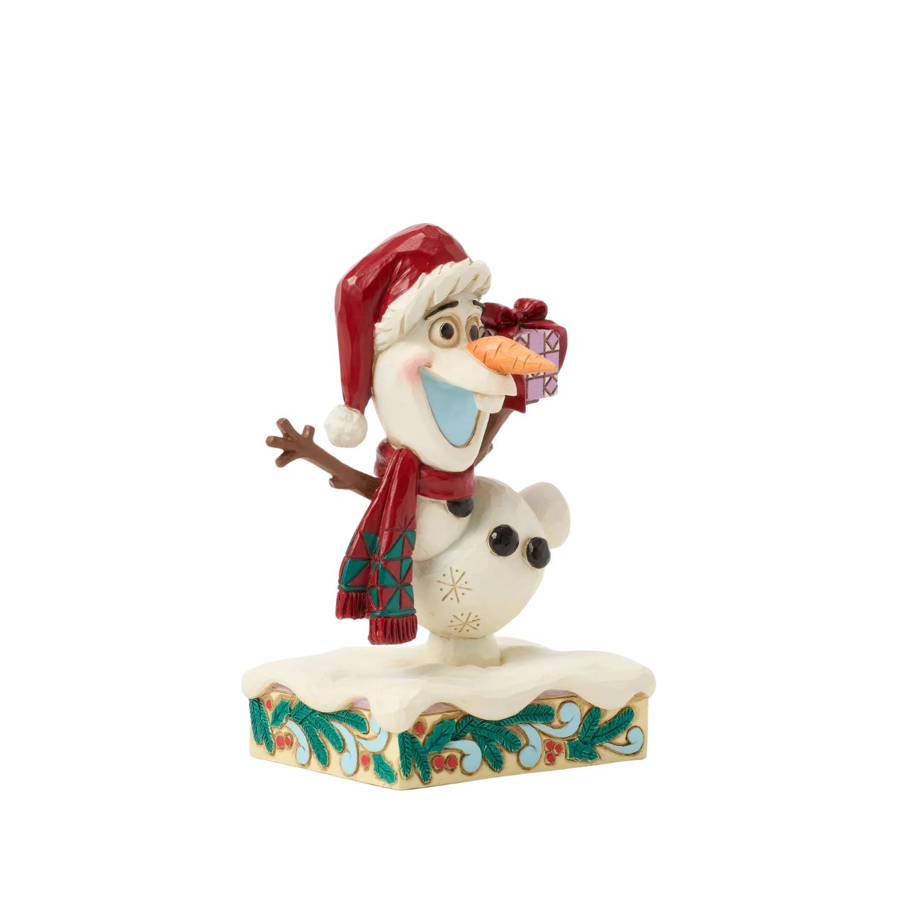 In this joyful Jim Shore design, Olaf dances merrily in the snow with a wide smile, donning a Santa hat and a festive scarf while carrying a colourful present. Adorned with charming rosemaling details, this delightful piece captures holiday cheer.