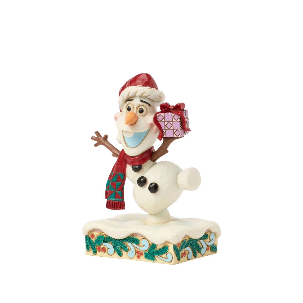 In this joyful Jim Shore design, Olaf dances merrily in the snow with a wide smile, donning a Santa hat and a festive scarf while carrying a colourful present. Adorned with charming rosemaling details, this delightful piece captures holiday cheer.