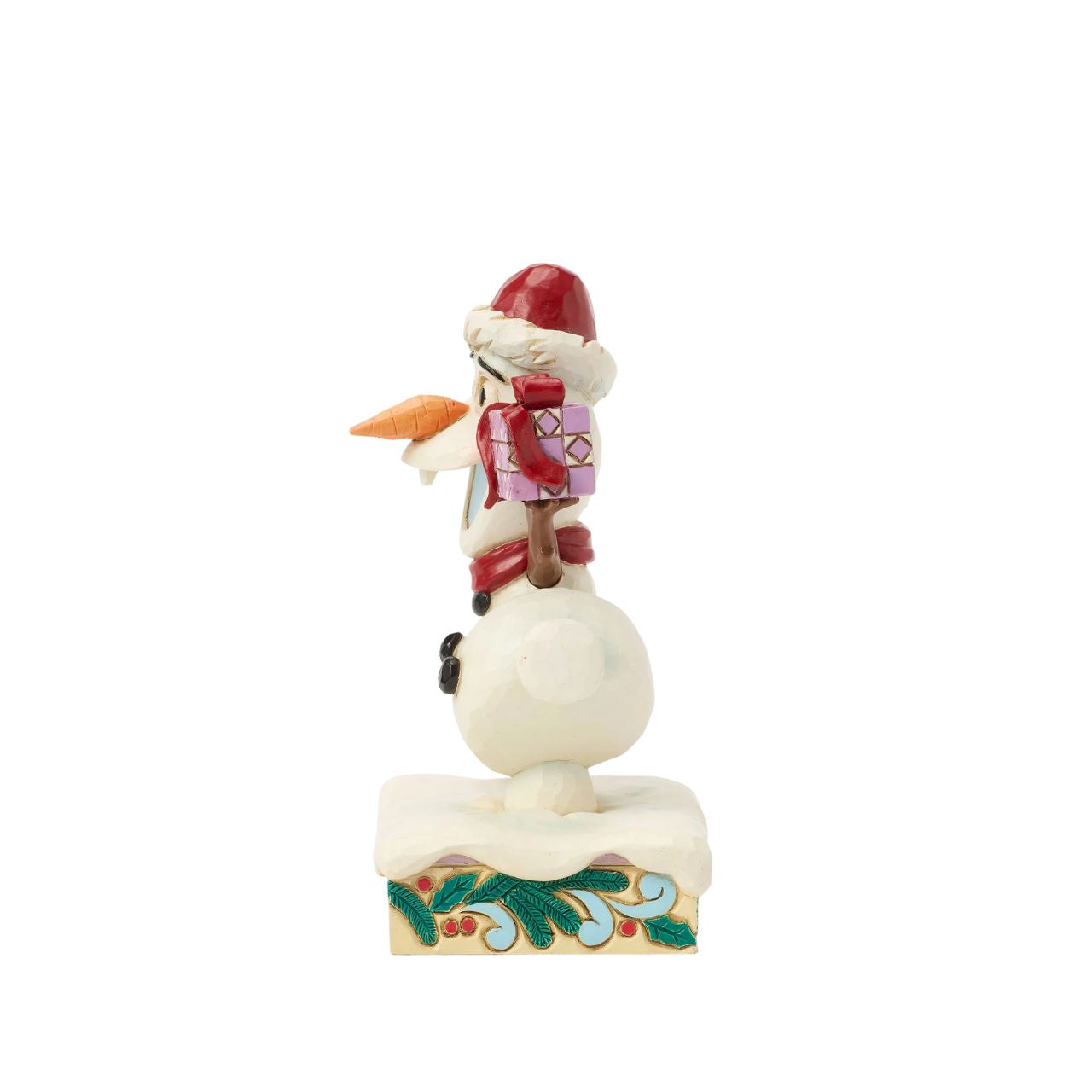 In this joyful Jim Shore design, Olaf dances merrily in the snow with a wide smile, donning a Santa hat and a festive scarf while carrying a colourful present. Adorned with charming rosemaling details, this delightful piece captures holiday cheer.