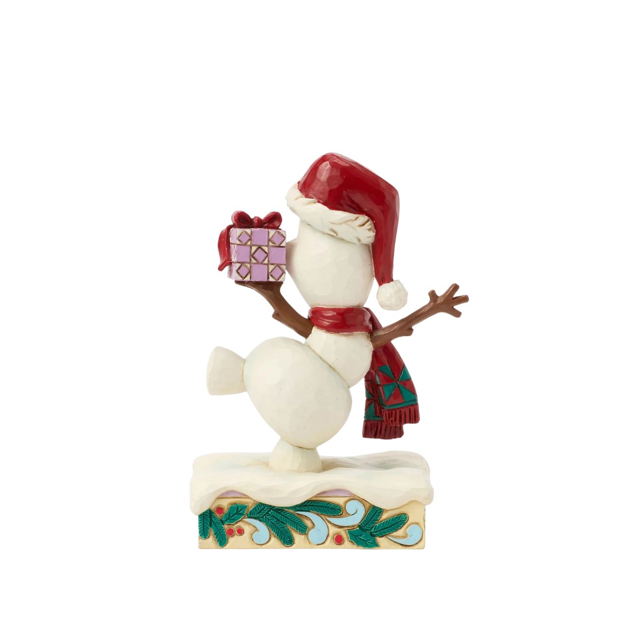 In this joyful Jim Shore design, Olaf dances merrily in the snow with a wide smile, donning a Santa hat and a festive scarf while carrying a colourful present. Adorned with charming rosemaling details, this delightful piece captures holiday cheer.