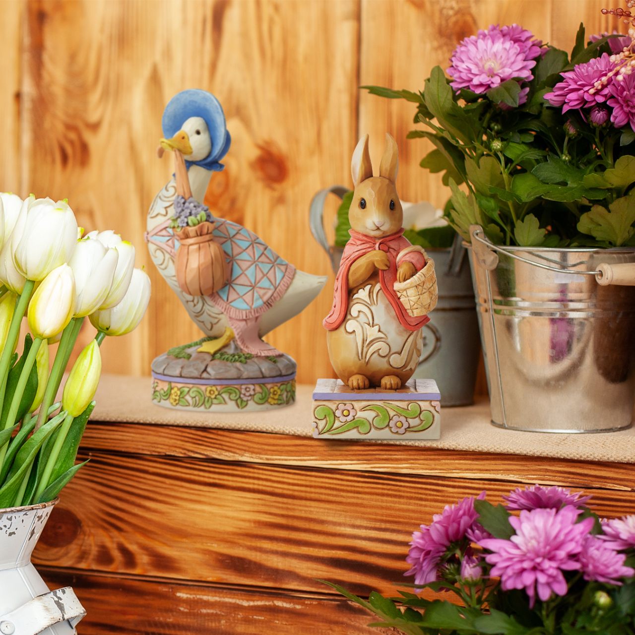 Beatrix Potter Flopsy Good Little Bunny Figurine  Award winning folk artist Jim Shore brings his unique style to Beatrix Potter's beloved story, The Tale of Peter Rabbit, through charming hand-crafted gifts that will delight her readers of all ages. This Jim Shore figurine features the ever-so-sweet Flopsy, standing gracefully in her famous pink cape. 