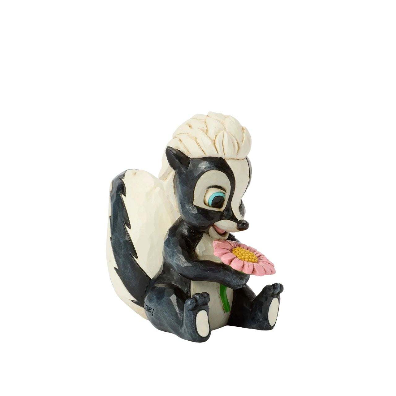 This darling Jim Shore miniature features Flower, the skunk from Bambi, adorned with striking rosemaling and holding a handful of fresh flowers. With a bright smile and childlike love, she radiates sweetness and charm.
