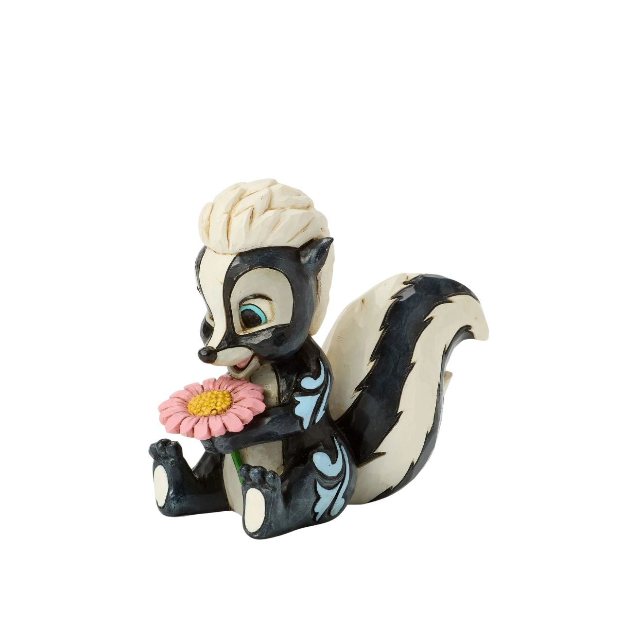 This darling Jim Shore miniature features Flower, the skunk from Bambi, adorned with striking rosemaling and holding a handful of fresh flowers. With a bright smile and childlike love, she radiates sweetness and charm.