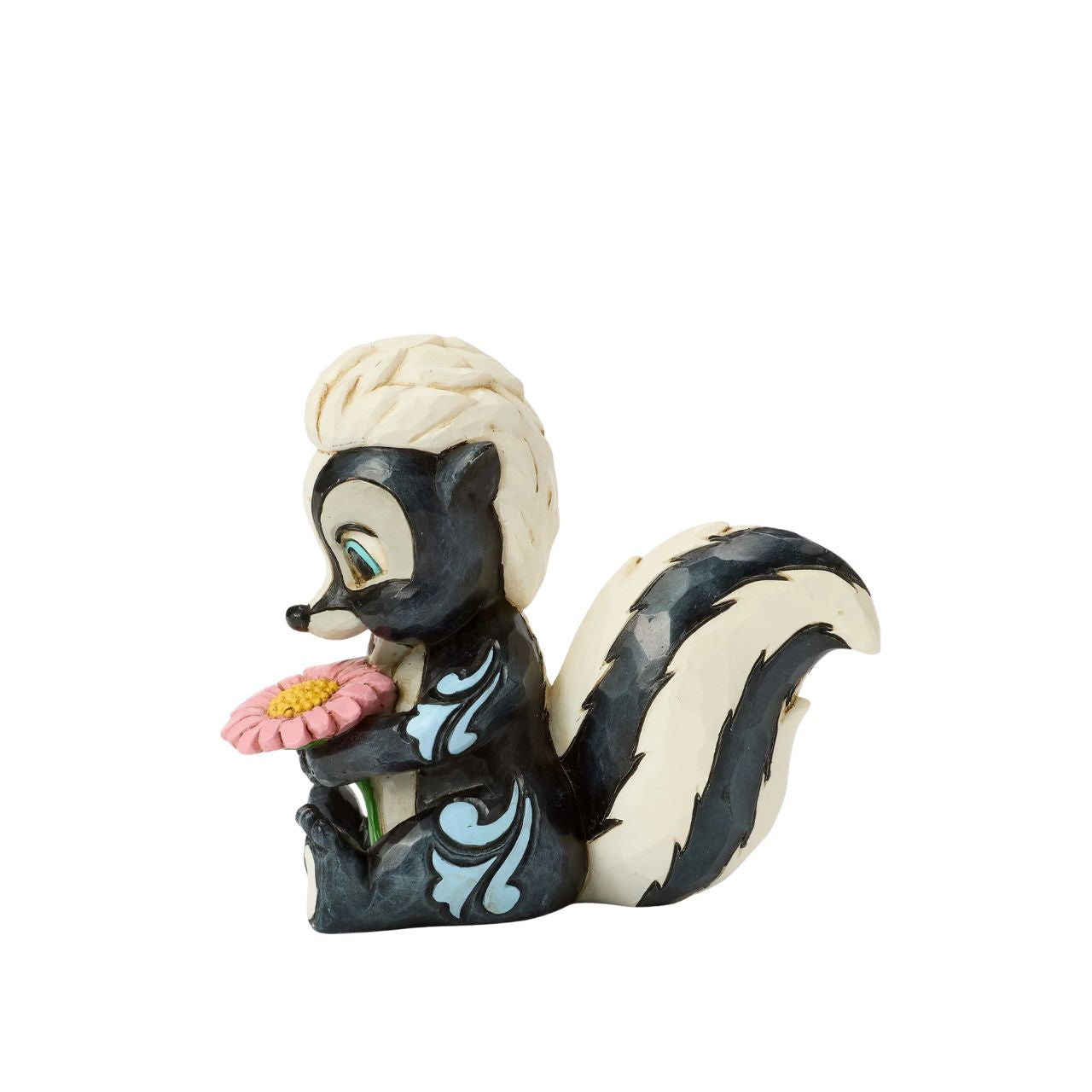 This darling Jim Shore miniature features Flower, the skunk from Bambi, adorned with striking rosemaling and holding a handful of fresh flowers. With a bright smile and childlike love, she radiates sweetness and charm.