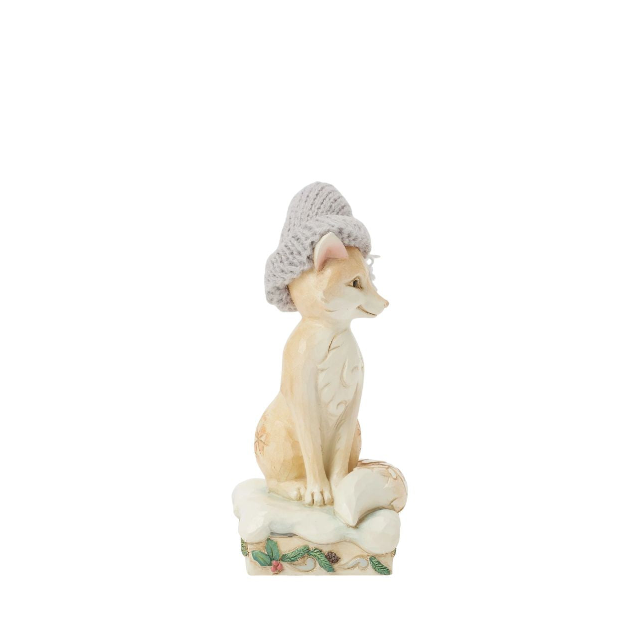 This stunning Jim Shore design features a majestic fox adorned with a cosy red knitted cap, exuding charm and warmth. Decorated with the artist's iconic rosemaling and patchwork patterns on its fur, this piece captures the whimsical spirit of nature.