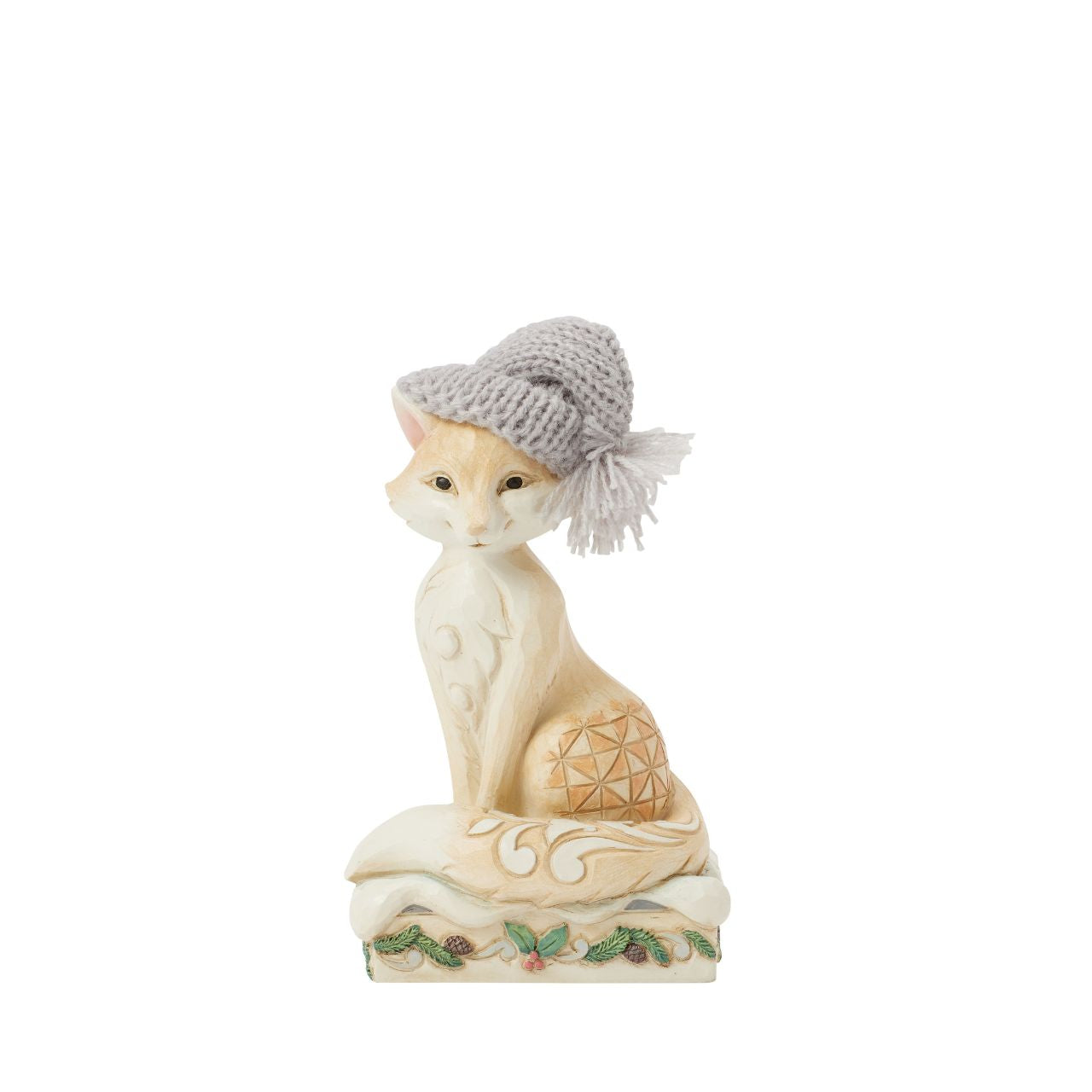 This stunning Jim Shore design features a majestic fox adorned with a cosy red knitted cap, exuding charm and warmth. Decorated with the artist's iconic rosemaling and patchwork patterns on its fur, this piece captures the whimsical spirit of nature.