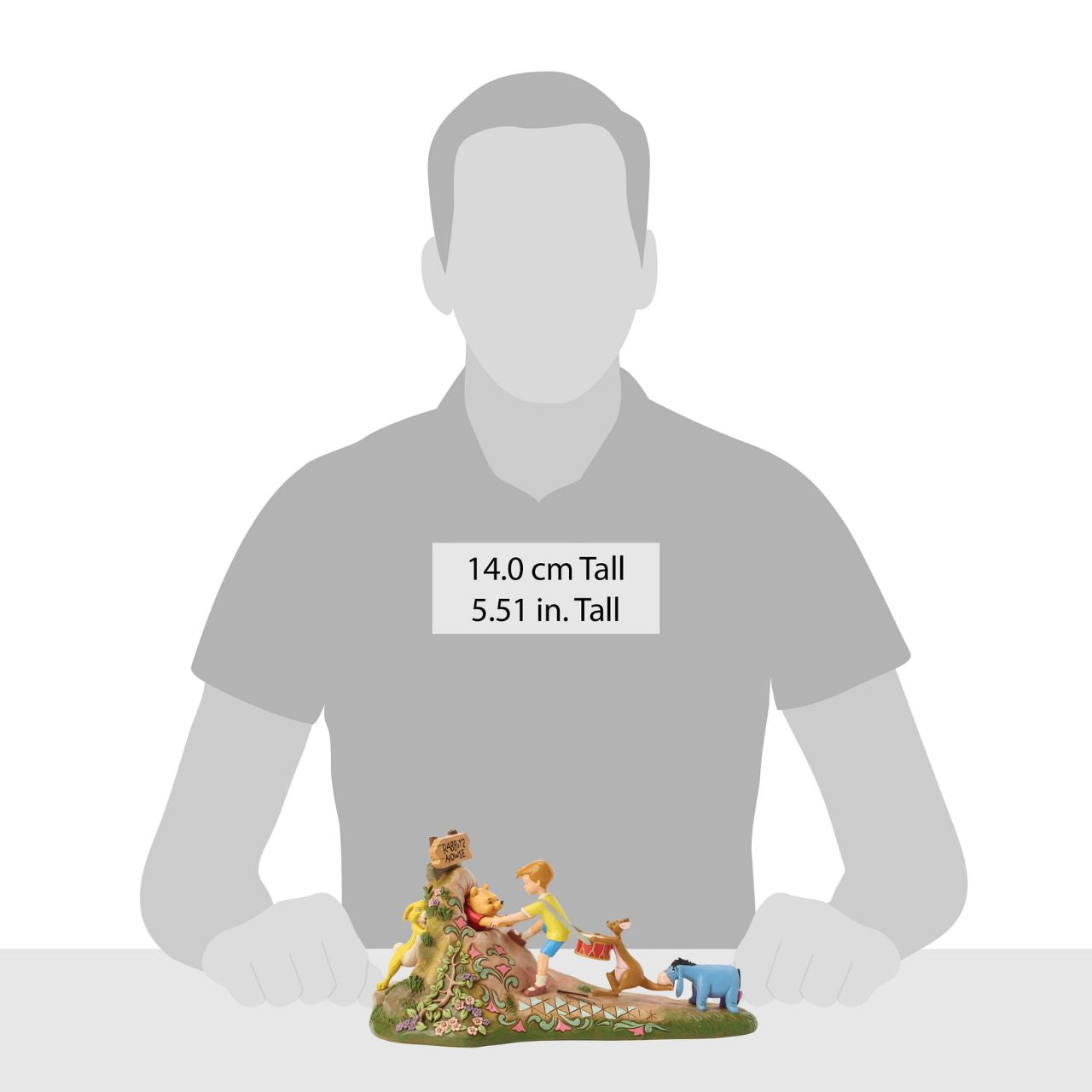 After a celebration in the Hundred Acre Wood, Pooh needs a little help exiting Rabbit's House. Christopher Robin, Kanga, and Eeyore pull Pooh's hands while Rabbit pushes from behind. Adorned with Jim Shore's iconic detailing and soft floral accents.