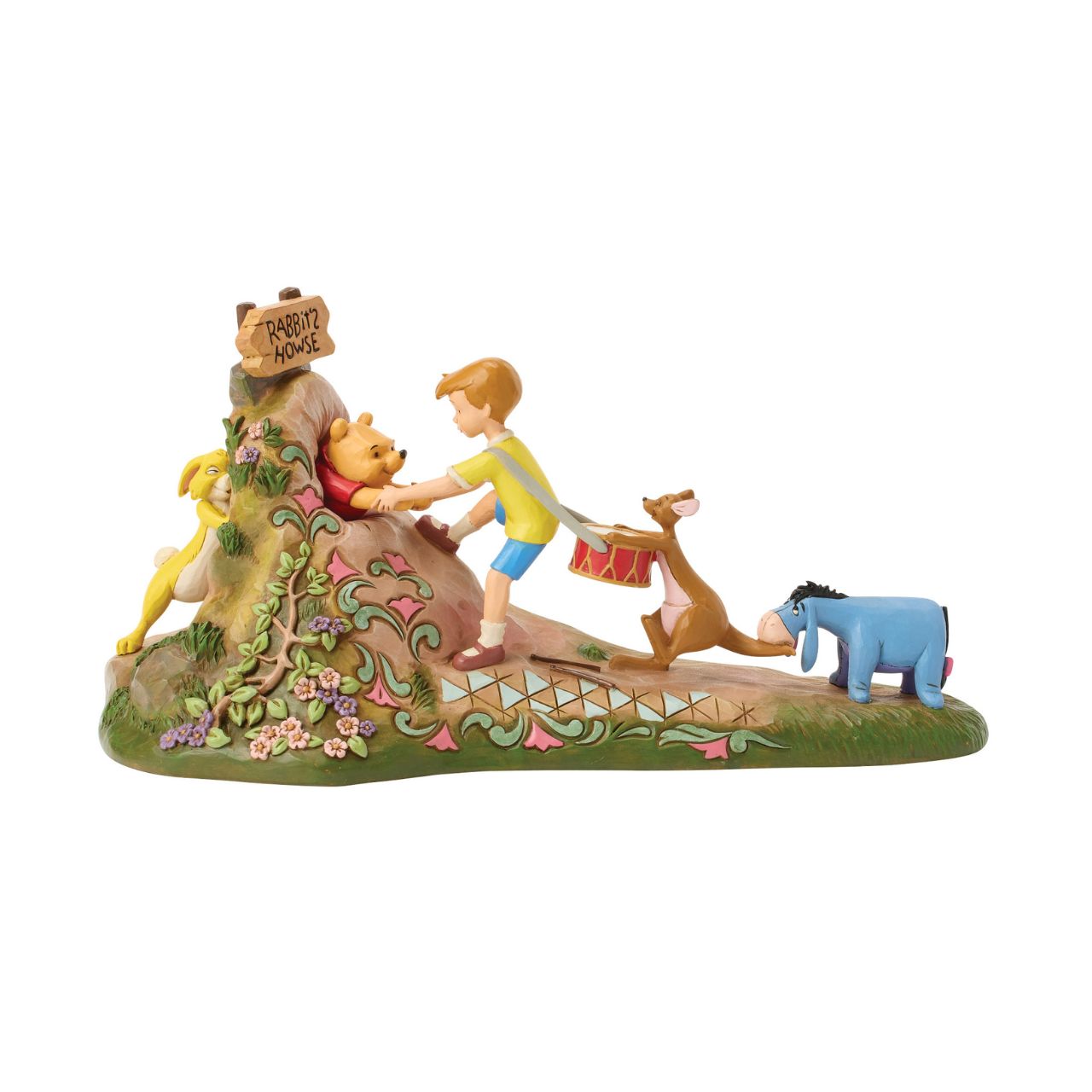 After a celebration in the Hundred Acre Wood, Pooh needs a little help exiting Rabbit's House. Christopher Robin, Kanga, and Eeyore pull Pooh's hands while Rabbit pushes from behind. Adorned with Jim Shore's iconic detailing and soft floral accents.