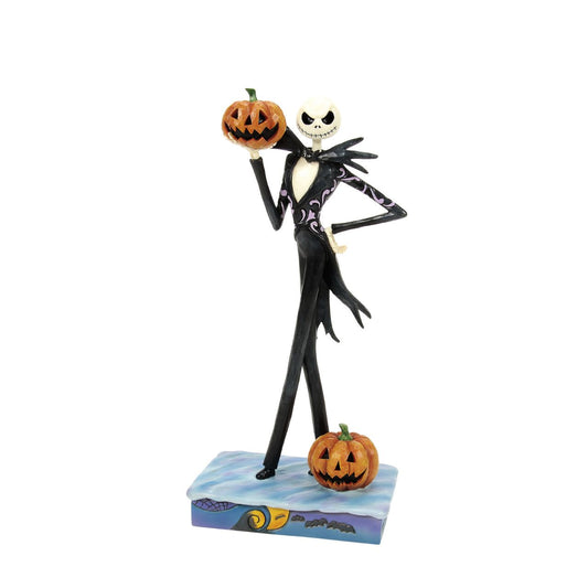 In this captivating Jim Shore design, Jack Skellington, clad in a striking black and white suit, exudes charm with a mischievous grin as he holds a Jack-o-lantern. Bring home Jim's newest The Nightmare Before Christmas designs.
