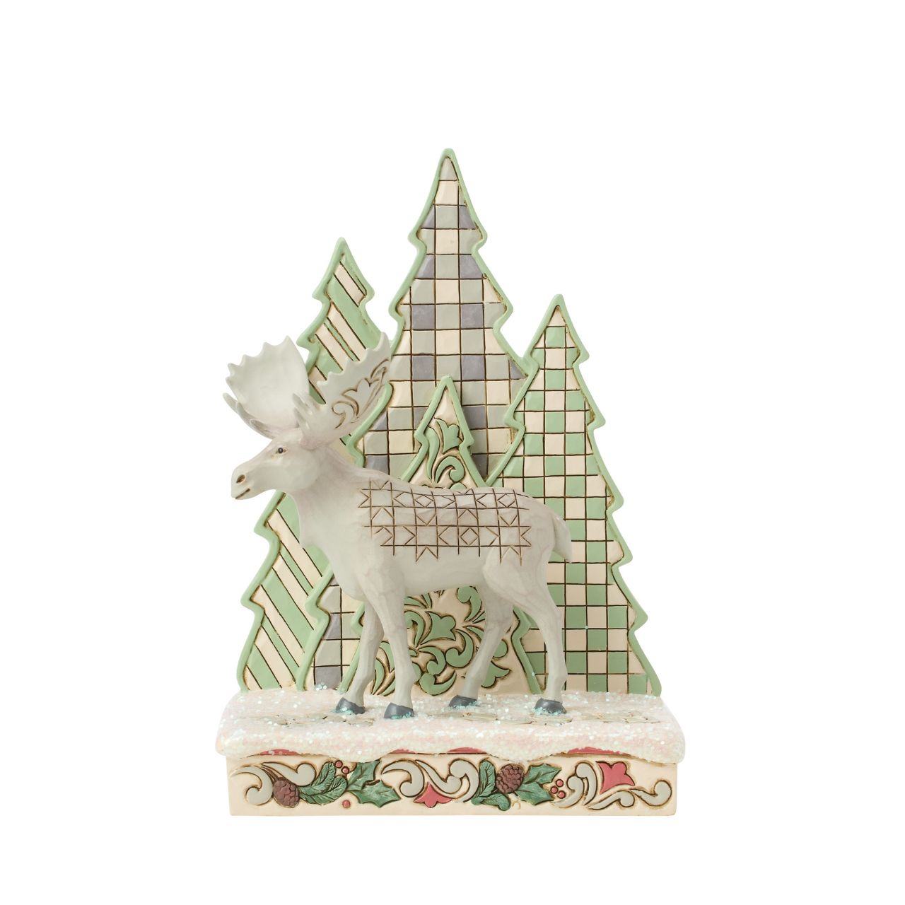 This captivating Jim Shore design features a majestic moose adorned with the artist's signature patchwork patterning on his hide, standing against a backdrop of uniquely patterned trees. With intricate details, it captures the peace of the forest.