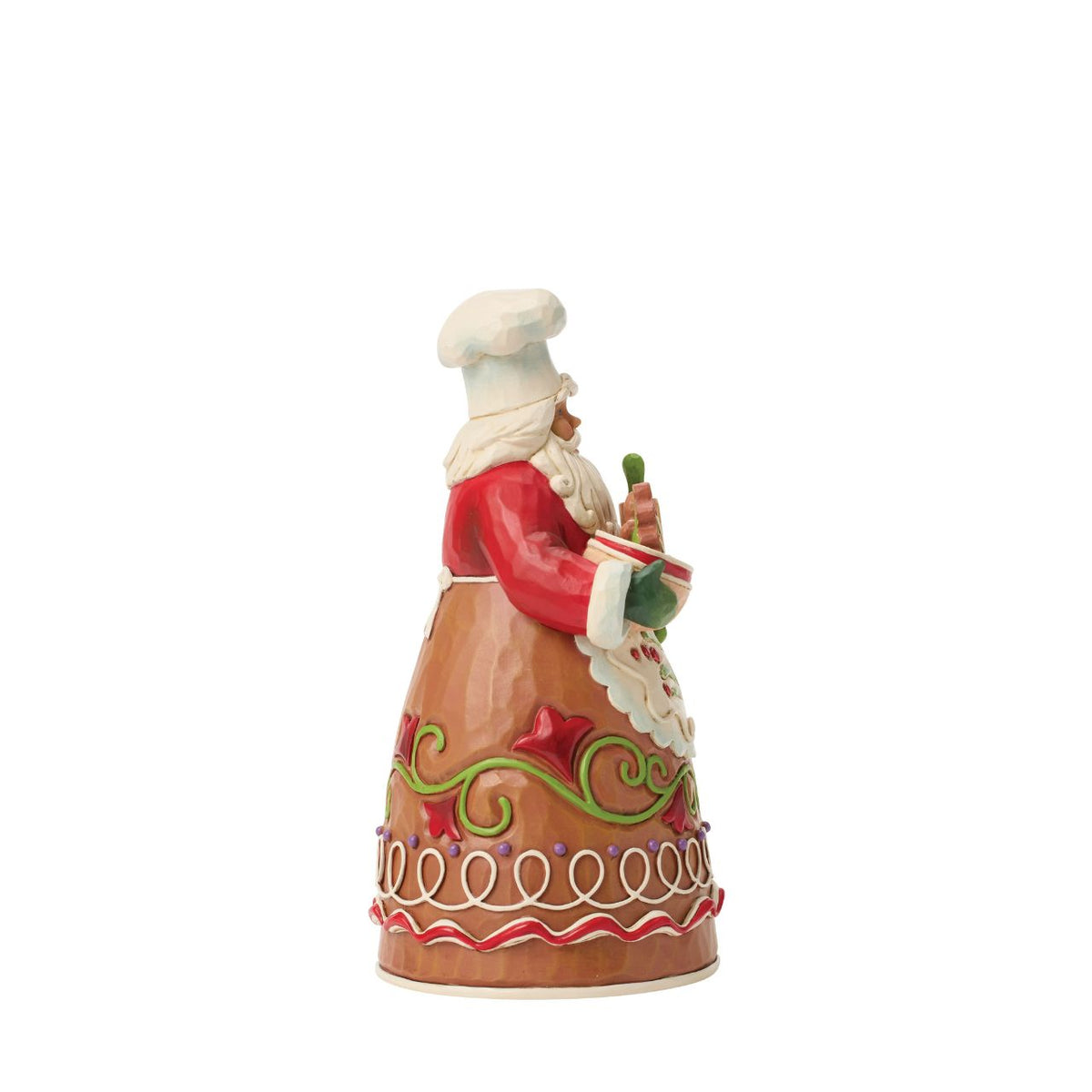 Dressed in a chef's hat and apron, this gingerbread Santa is ready to bake up Christmas joy. Jim Shore's playful patterns and candy-like details give the design a delightful, sugar-coated charm. A treat for both collectors and holiday kitchens alike.
