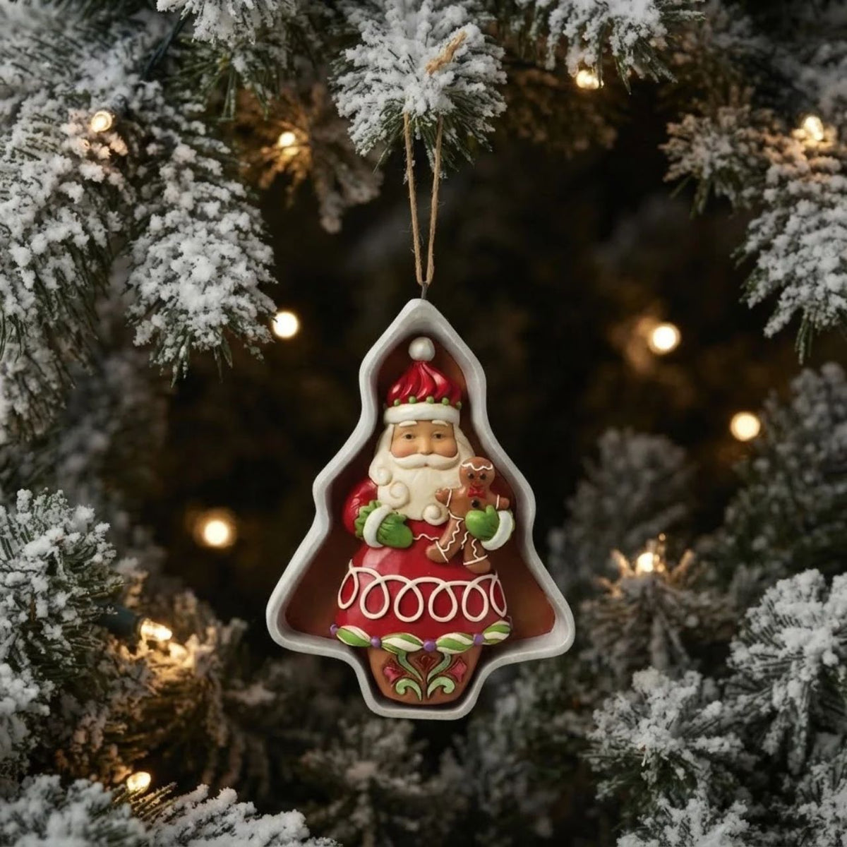 Enhance your Christmas collection with this Heartwood Creek Santa Cookie Cutter figurine by Jim Shore. Perfect for those seeking high-quality, collectible holiday decor. A heartwarming addition to any festive display.