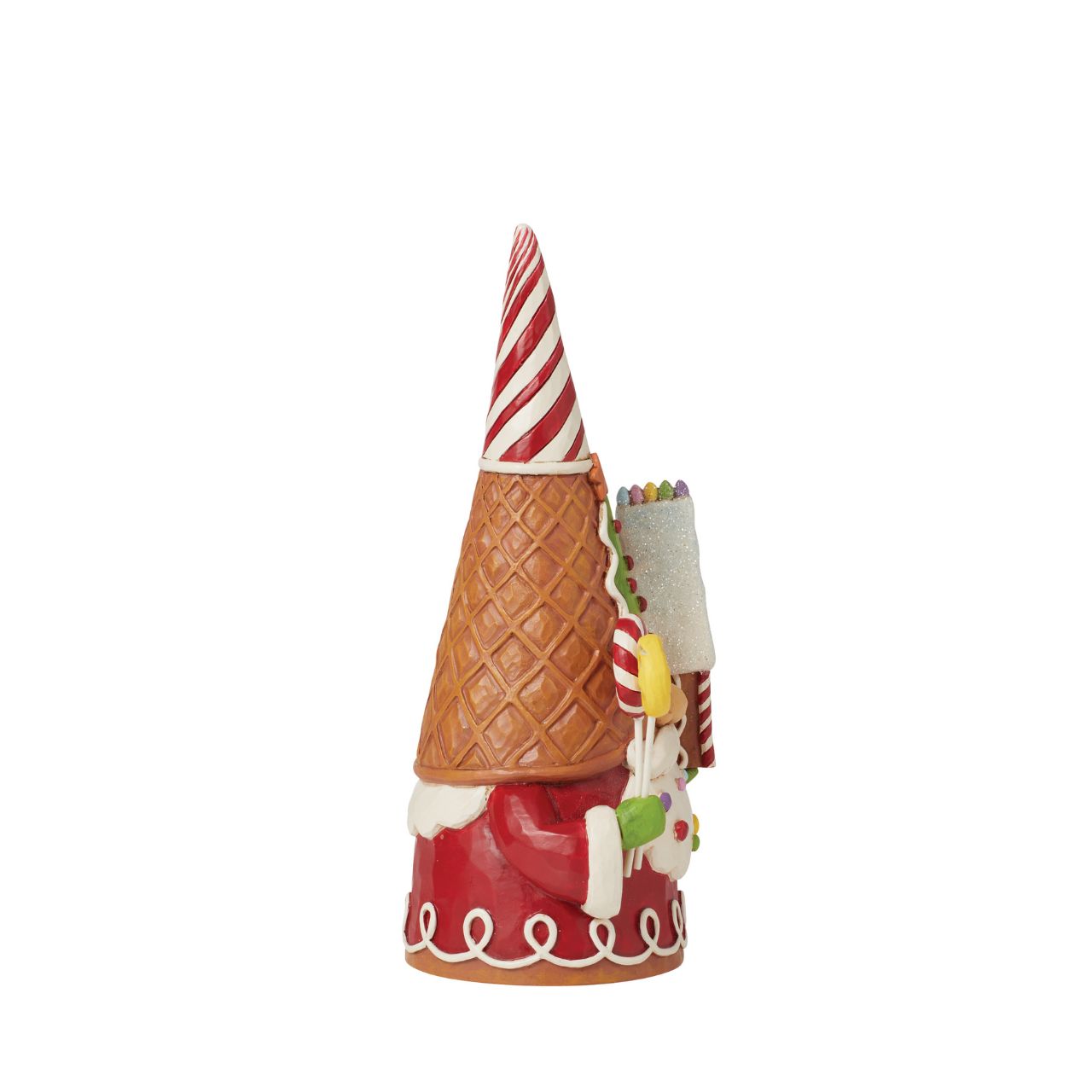 Add some candy to your Christmas with this festive gingerbread gnome from Jim Shore! Wearing a waffle cone hat, he holds peppermint lollipops and a gingerbread house. With sprinkles in his beard, he celebrates the sweetness of the season.