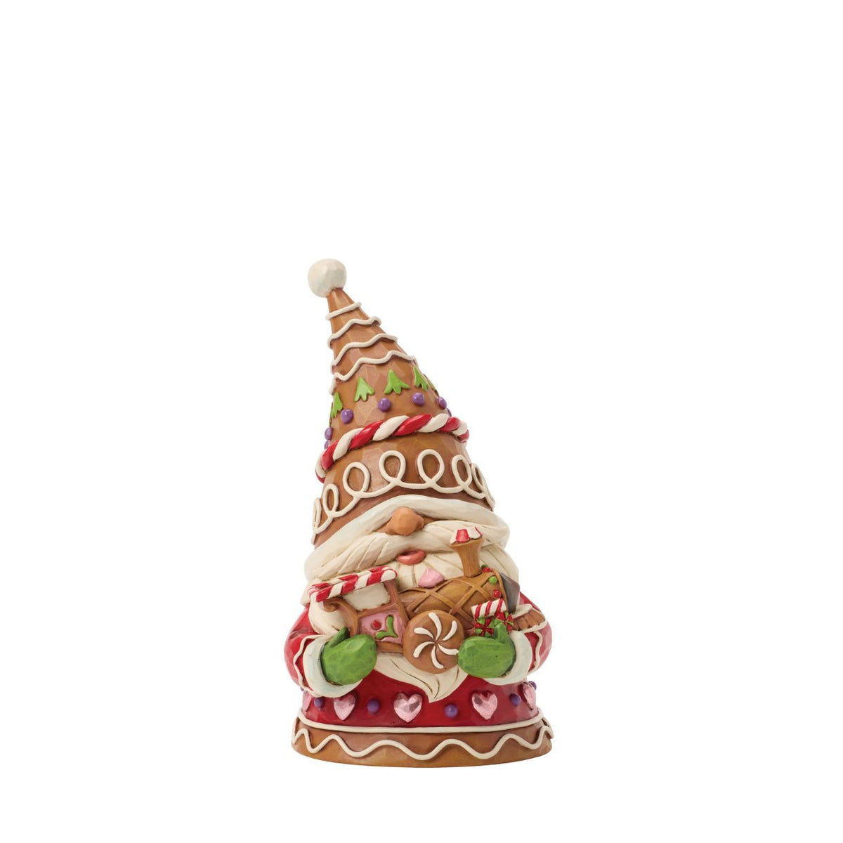 Full of charm, this gingerbread gnome stands proudly with a candy-powered train. Jim Shore's detailing adds warmth and character, turning a playful scene into a treasured holiday memory. Perfect for lovers of gnomes and gingerbread alike.