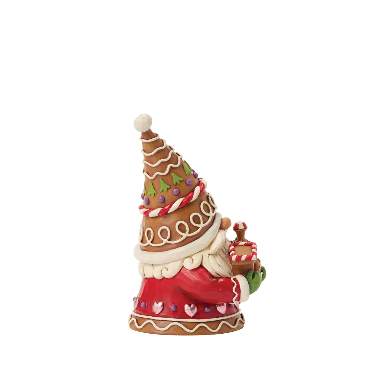 Full of charm, this gingerbread gnome stands proudly with a candy-powered train. Jim Shore's detailing adds warmth and character, turning a playful scene into a treasured holiday memory. Perfect for lovers of gnomes and gingerbread alike.