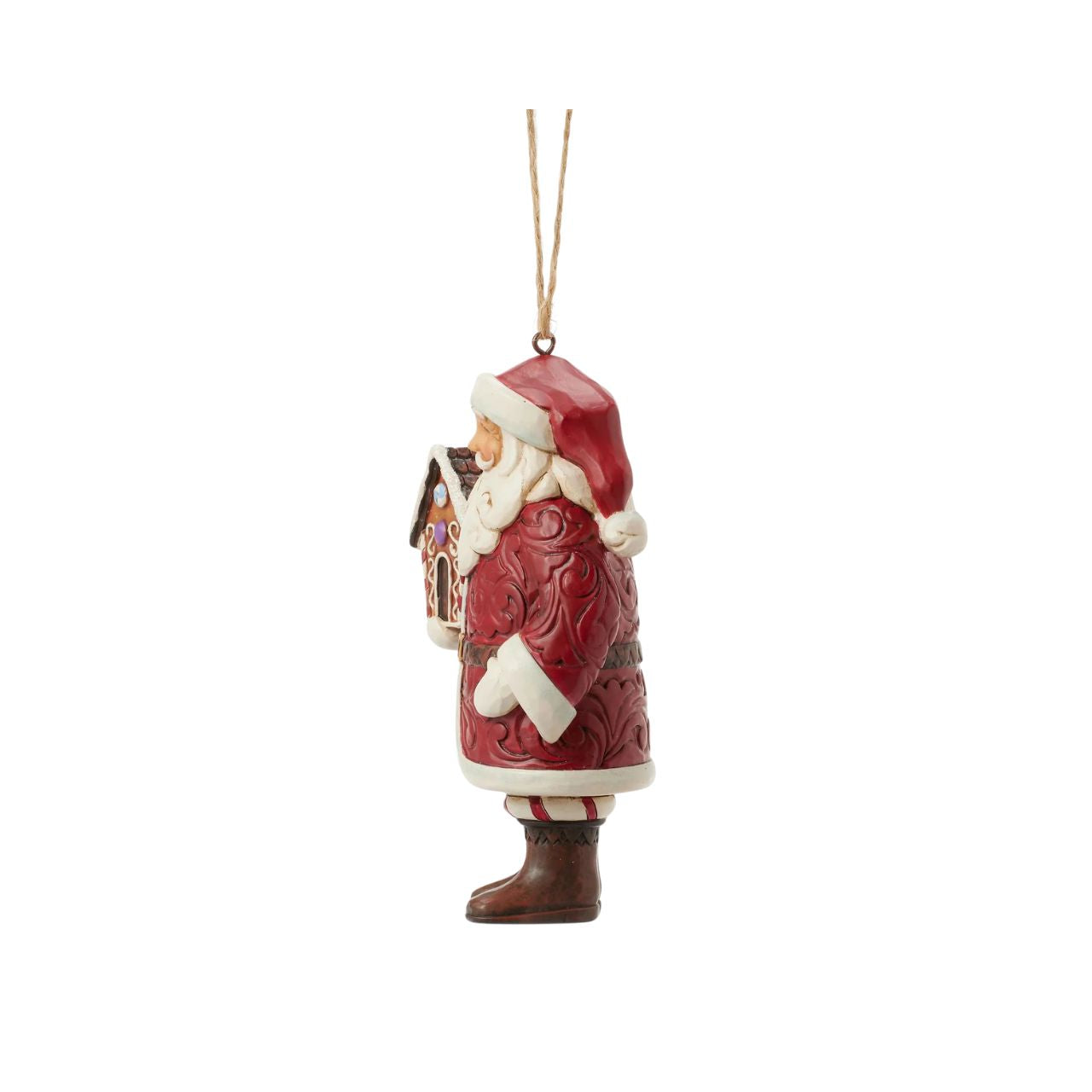 This stunning Gingerbread Christmas Jim Shore ornament features Santa holding a beautifully crafted gingerbread house and a candy cane, all while draped in an ornate rosemaling cloak. With intricate details and vibrant colours, this Santa captures the holiday spirit.