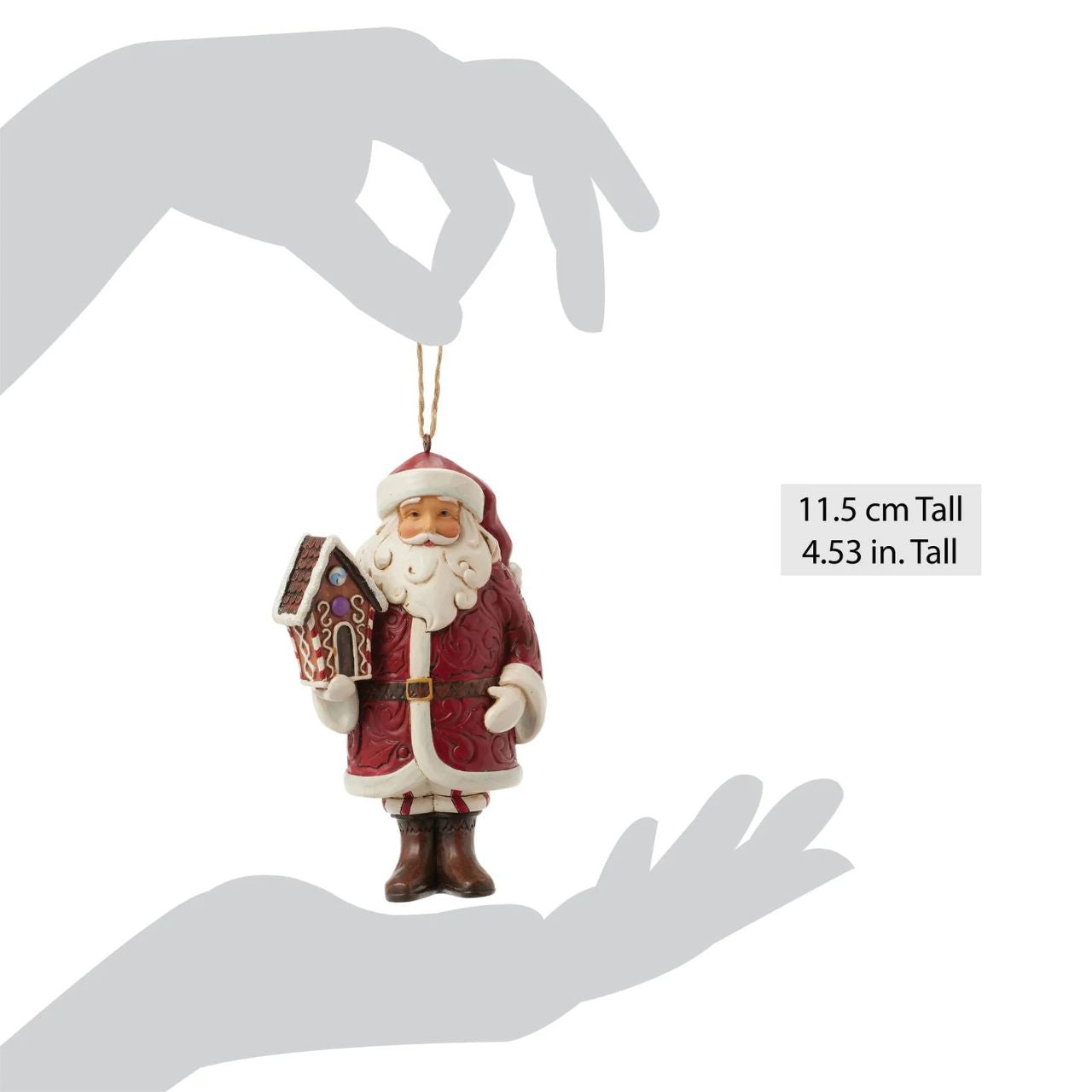 This stunning Gingerbread Christmas Jim Shore ornament features Santa holding a beautifully crafted gingerbread house and a candy cane, all while draped in an ornate rosemaling cloak. With intricate details and vibrant colours, this Santa captures the holiday spirit.