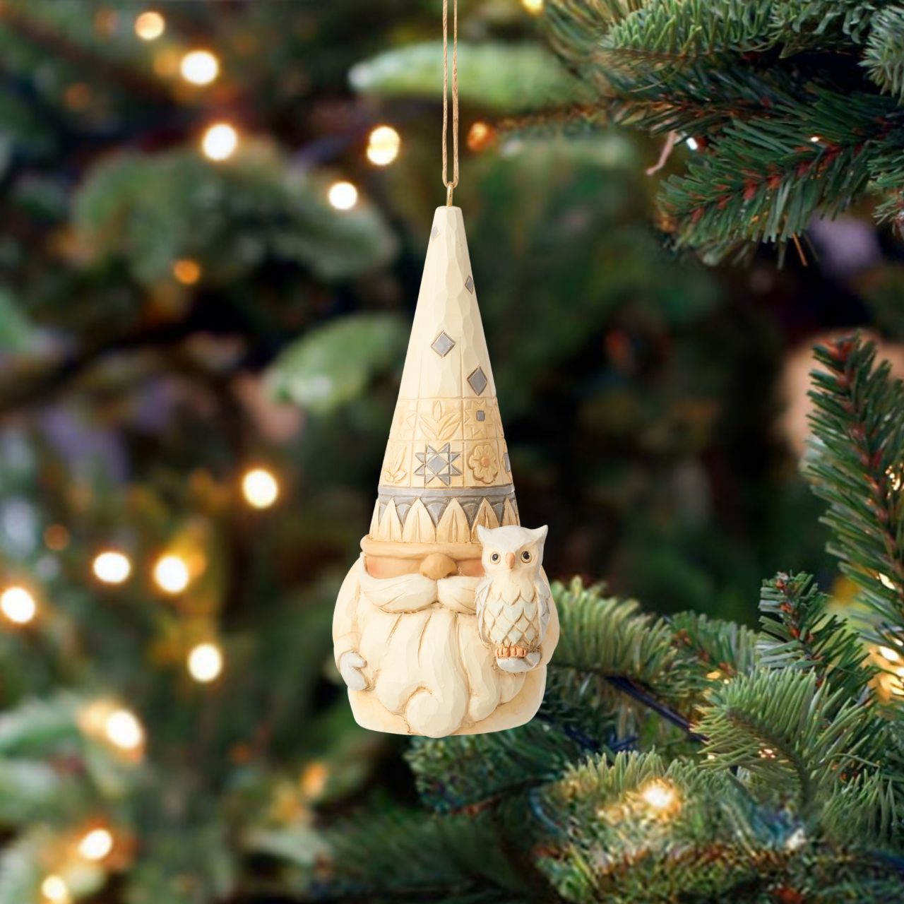 Gnome with Owl Hanging Ornament by Jim Shore  The White Woodland Collection; Intricate Jim Shore designs, with soft neutral colour palette suitable for many styles of home décor. This delightful Gnome Hanging Ornament is the perfect addition to any tree.
