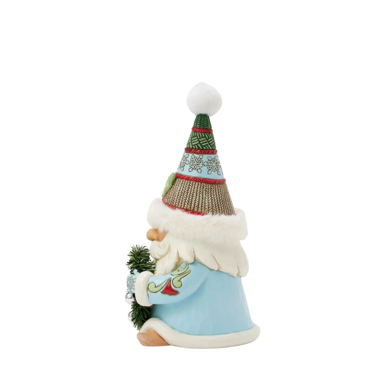 This festive Jim Shore gnome embodies holiday charm with a cozy hat with faux fur trim, intricate rosemaling, and snowflake patterns. Carrying a beautifully decorated wreath, he exudes warmth and joy bringing the spirit of Christmas to any space.