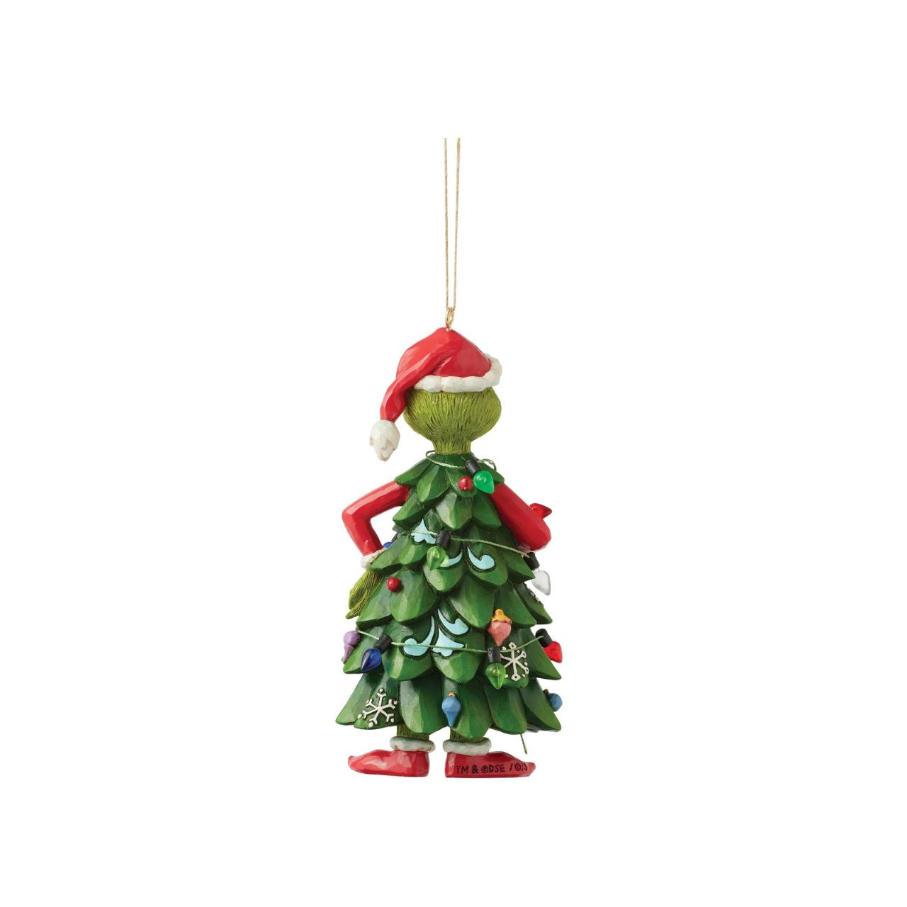 Dressed as a Christmas tree, the Grinch holds an ornament, mischievously decorating himself in this playful Jim Shore design.