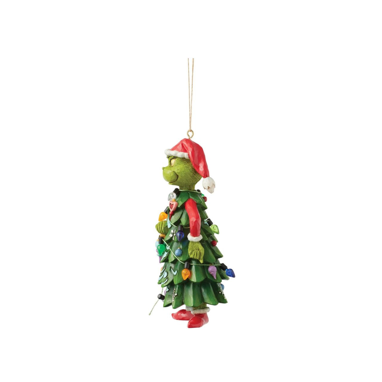 Dressed as a Christmas tree, the Grinch holds an ornament, mischievously decorating himself in this playful Jim Shore design.