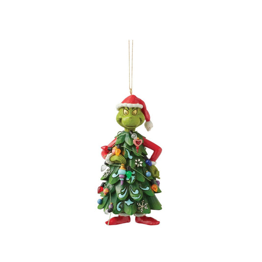 Dressed as a Christmas tree, the Grinch holds an ornament, mischievously decorating himself in this playful Jim Shore design.
