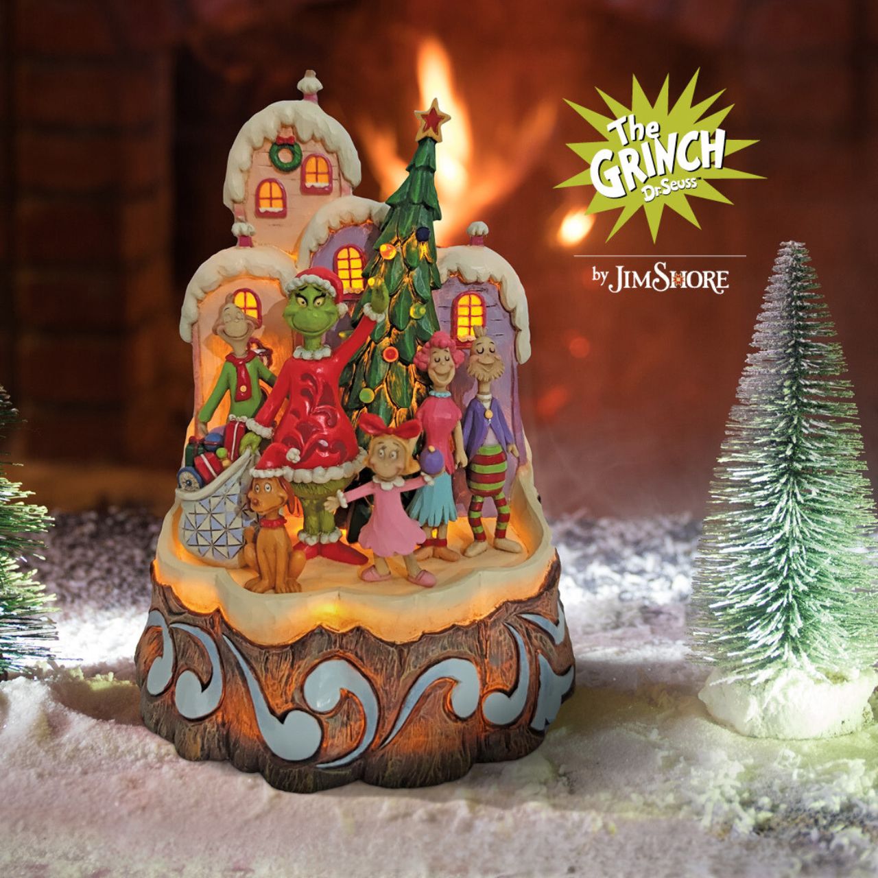 Dr. Seuss Grinch Carved by Heart Figurine  With an honest smile, the Grinch, by Jim Shore, has realized the true meaning of Christmas and for once, feels love in his heart. Together with Max and the residents of Whoville, Grinch waves solemnly with Cindy Lou Who in the decorated town.