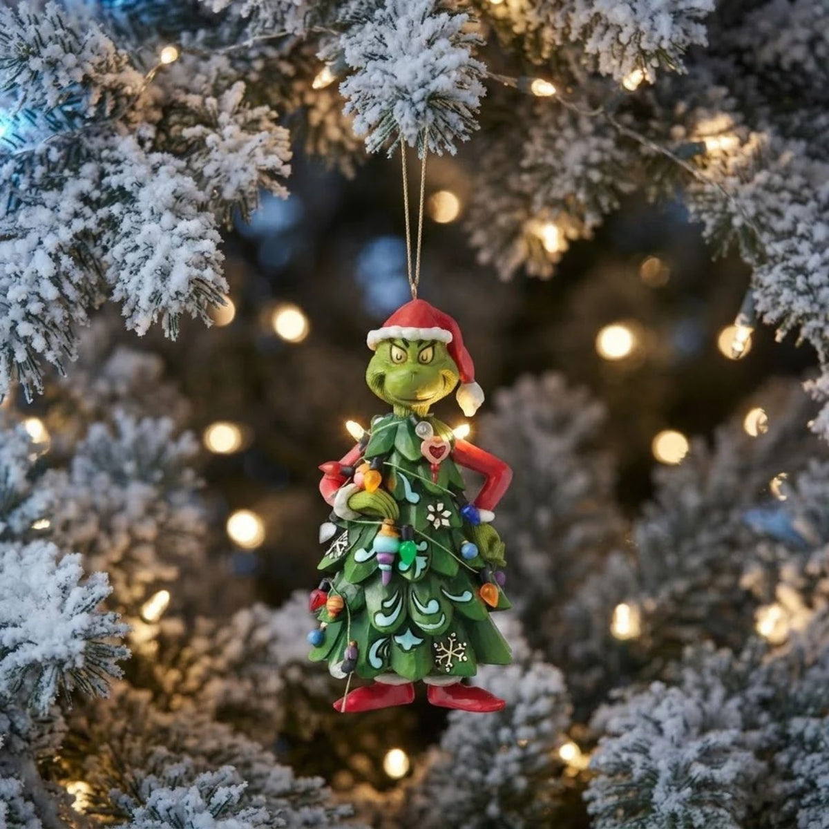 Dressed as a Christmas tree, the Grinch holds an ornament, mischievously decorating himself in this playful Jim Shore design. Disguising his scheme, he's ready to steal Christmas in plain sight, right from the branches of your Christmas tree.