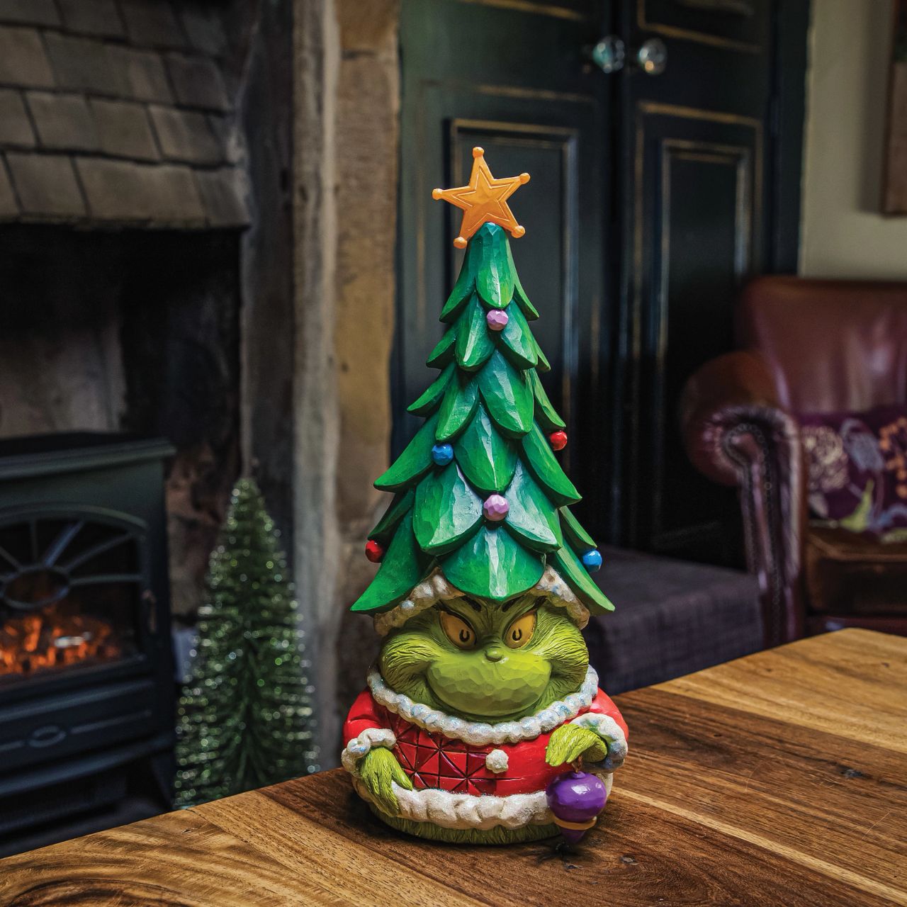 Known for his gnomes, Jim Shore presents his newest garden fairy crafted with Dr. Seuss flair. With a Christmas tree for a hat and a lit star, this grinning green Santa imposter delights with yellow eyes. Bring The Grinch home this holiday.
