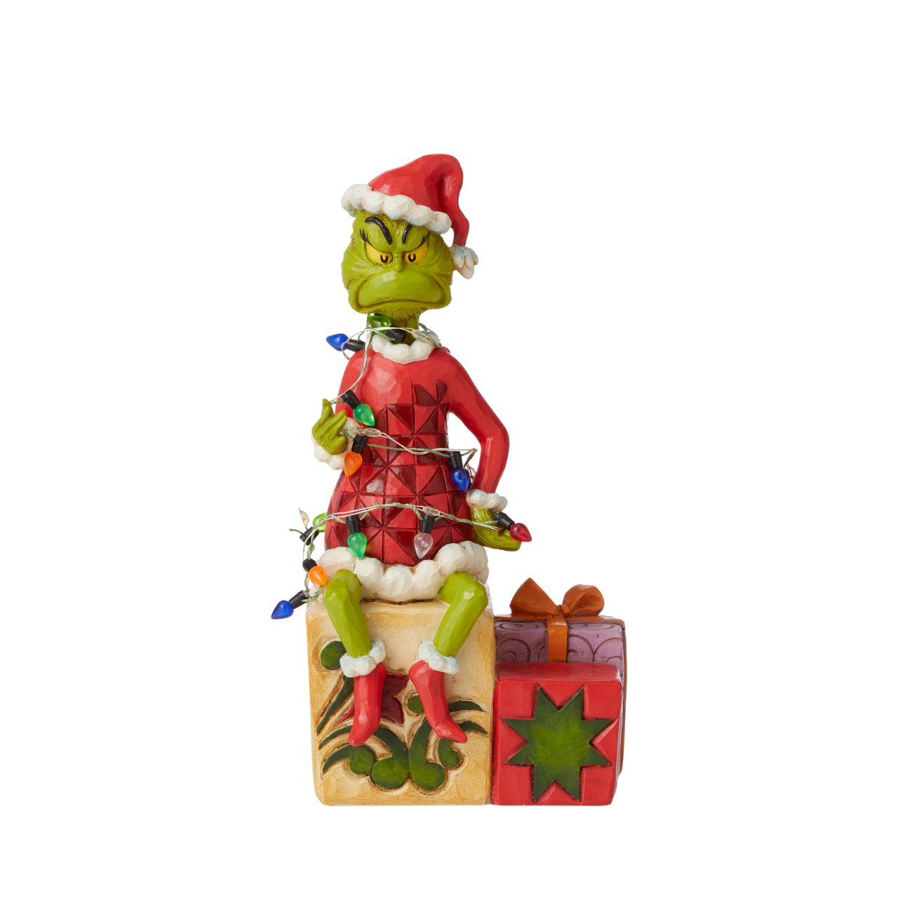 Grinch with lights Figurine - The Grinch  With a grimace on his green grouchy face, the Grinch, by Jim Shore, finds himself wrapped in a glowing string of lights as he tries to ruin the holiday. Sitting on a present, the Grinch gathers himself before he continues stealing Whoville gifts.