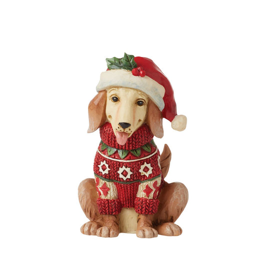Heartwood Creek Festive Dog Mini Figurine  Designed by award winning artist Jim Shore as part of the Heartwood Creek Mini Figurine Collection, hand crafted using high quality cast stone and hand painted, this festive Dog is perfect for the Christmas season.