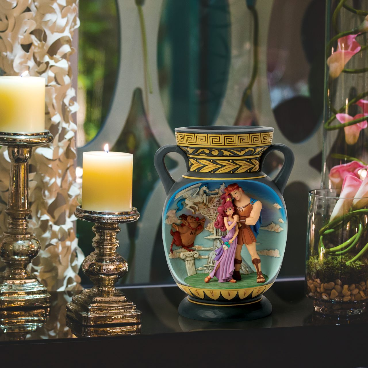 This bold Jim Shore design depicts Hercules in the style of ancient Greek pottery. With intricate storytelling and striking details, this inspired vase honours the legendary hero and Disney's timeless tale of strength and heart.