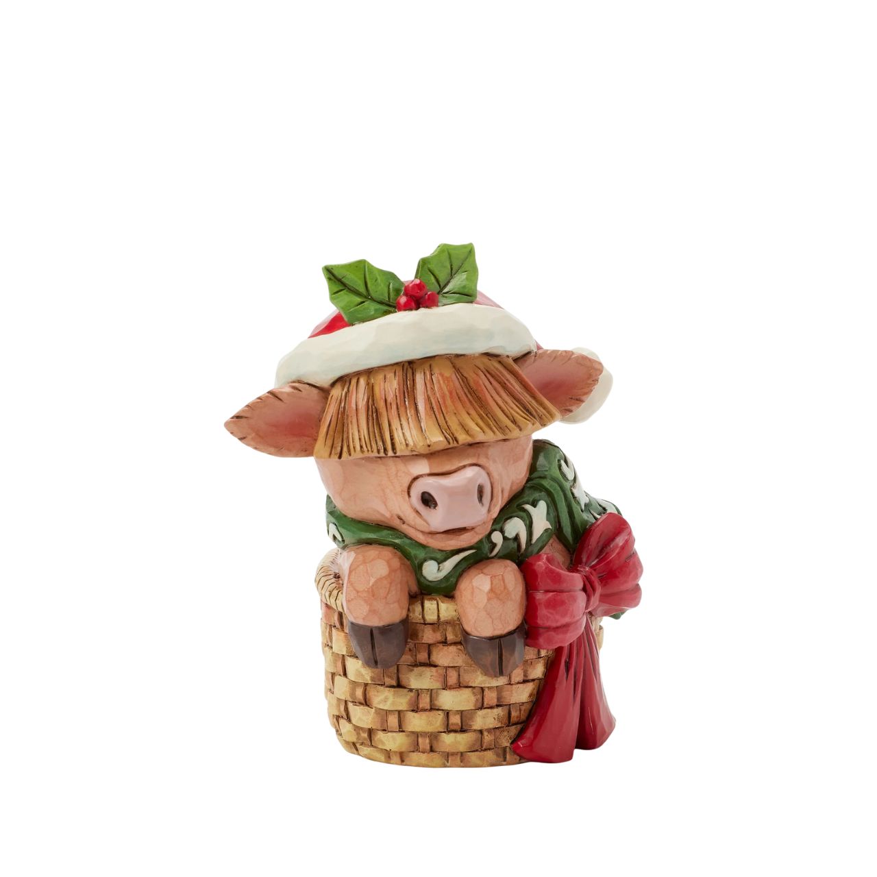 This adorable Jim Shore highland cow miniature radiates holiday cheer from within a cozy basket adorned with a festive bow. Dressed in a cheerful scarf and a Santa hat trimmed with holly, this delightful piece brings warmth and whimsy to your home.
