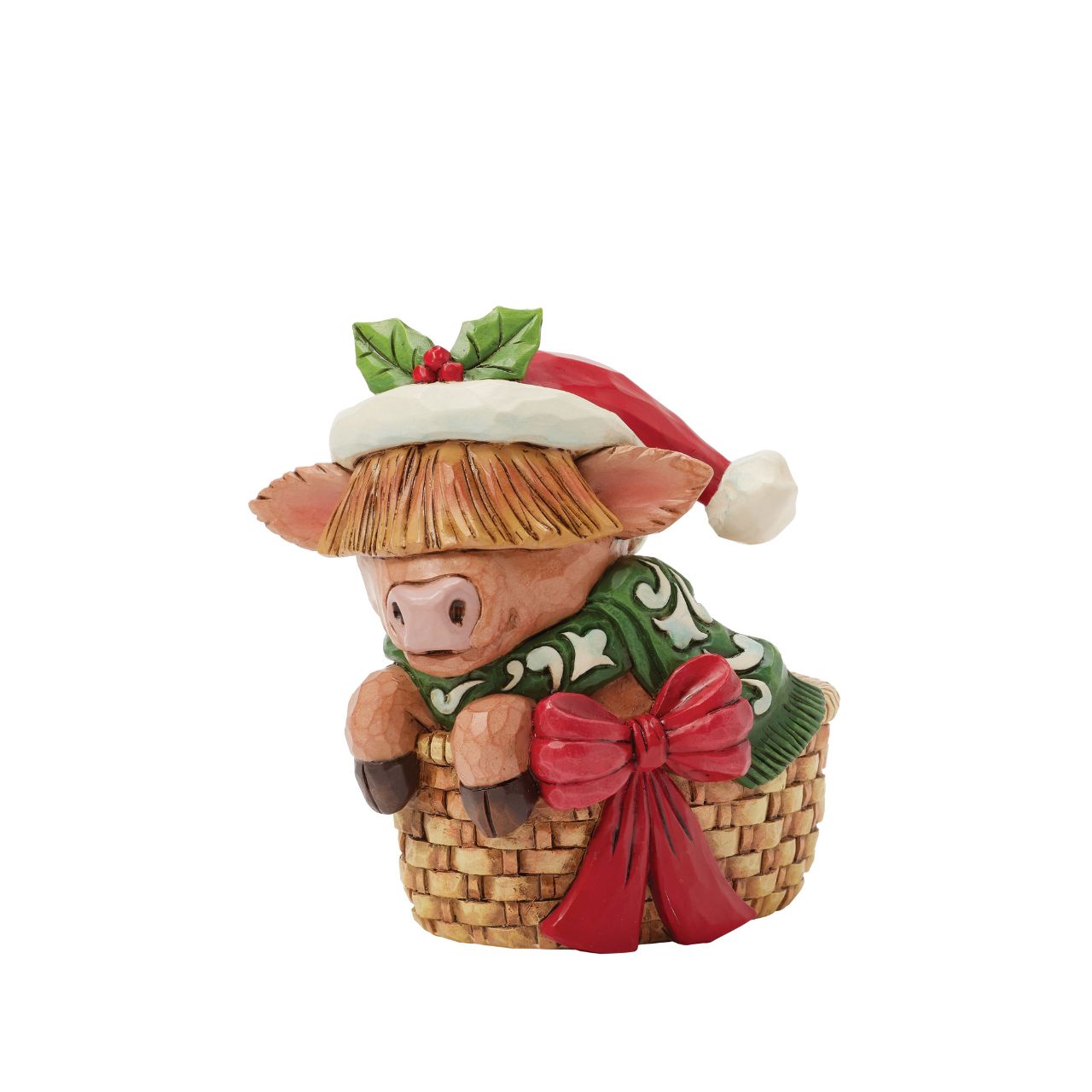 This adorable Jim Shore highland cow miniature radiates holiday cheer from within a cozy basket adorned with a festive bow. Dressed in a cheerful scarf and a Santa hat trimmed with holly, this delightful piece brings warmth and whimsy to your home.