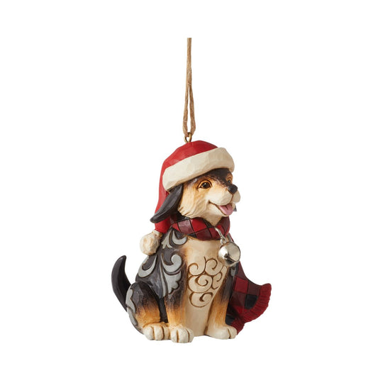 Heartwood Creek Highland Glen Dog in Scarf Hanging Ornament  Designed by award winning artist Jim Shore as part of the Heartwood Creek Highland Glen Collection, hand crafted using high quality cast stone and hand painted, this cute dog hanging ornament is perfect for the Christmas season.