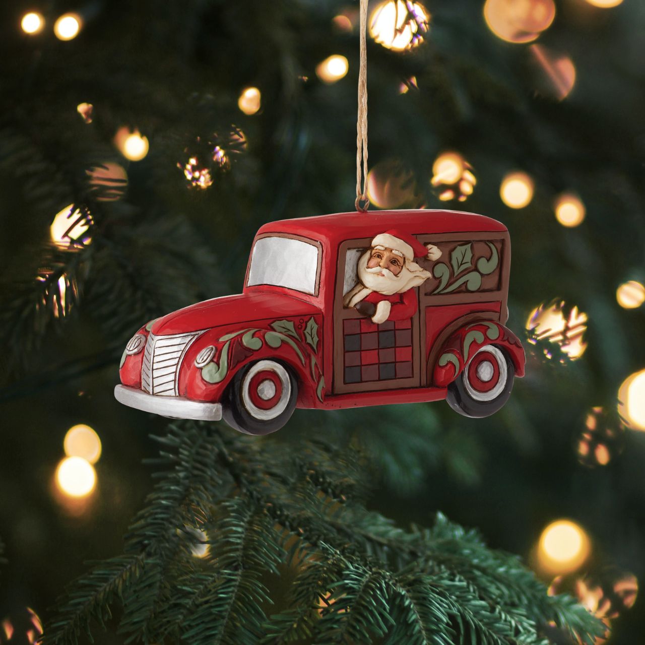 Heartwood Creek Highland Glen Santa with Wagon Hanging Ornament  Designed by award winning artist Jim Shore as part of the Heartwood Creek Highland Glen Collection, hand crafted using high quality cast stone and hand painted, this festive wagoneer hanging ornament is perfect for the Christmas season.