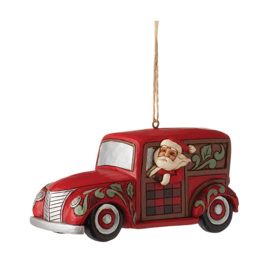 Heartwood Creek Highland Glen Santa with Wagon Hanging Ornament  Designed by award winning artist Jim Shore as part of the Heartwood Creek Highland Glen Collection, hand crafted using high quality cast stone and hand painted, this festive wagoneer hanging ornament is perfect for the Christmas season.