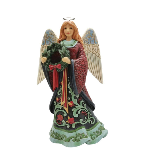Heartwood Creek Holiday Manor Christmas Angel Figurine  Designed by award winning artist Jim Shore as part of the Heartwood Creek Holiday Manor Collection, hand crafted using high quality cast stone and hand painted, this festive Angel is perfect for the Christmas season.