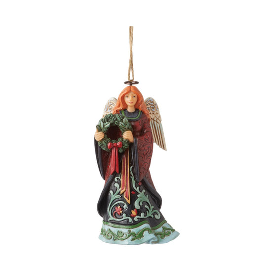 Heartwood Creek Holiday Manor Christmas Angel with Wreath Hanging Ornament  Designed by award winning artist Jim Shore as part of the Heartwood Creek Holiday Manor Collection, hand crafted using high quality cast stone and hand painted, this festive Angel with wreath hanging ornament is perfect for the Christmas season.