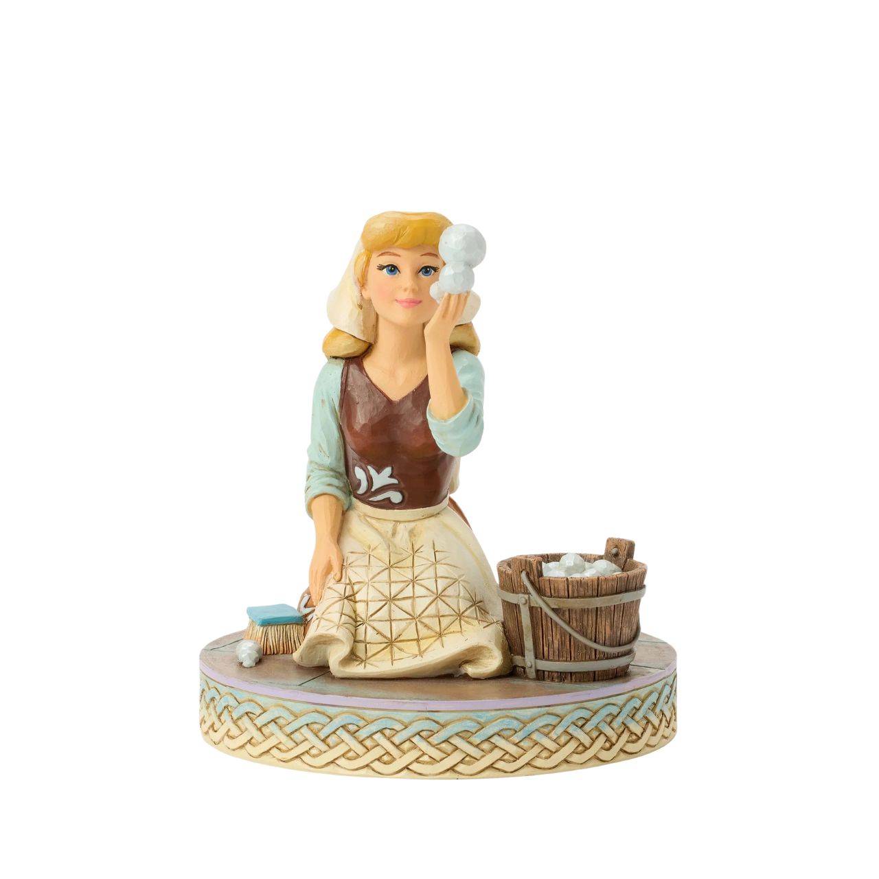 Cinderella's spirit remains unbroken in this inspiring Jim Shore scene. Dressed as a maid, she finds joy in her work, catching a bubble as she scrubs the floors. Jim Shore's enchanting details capture her beauty and resilience.