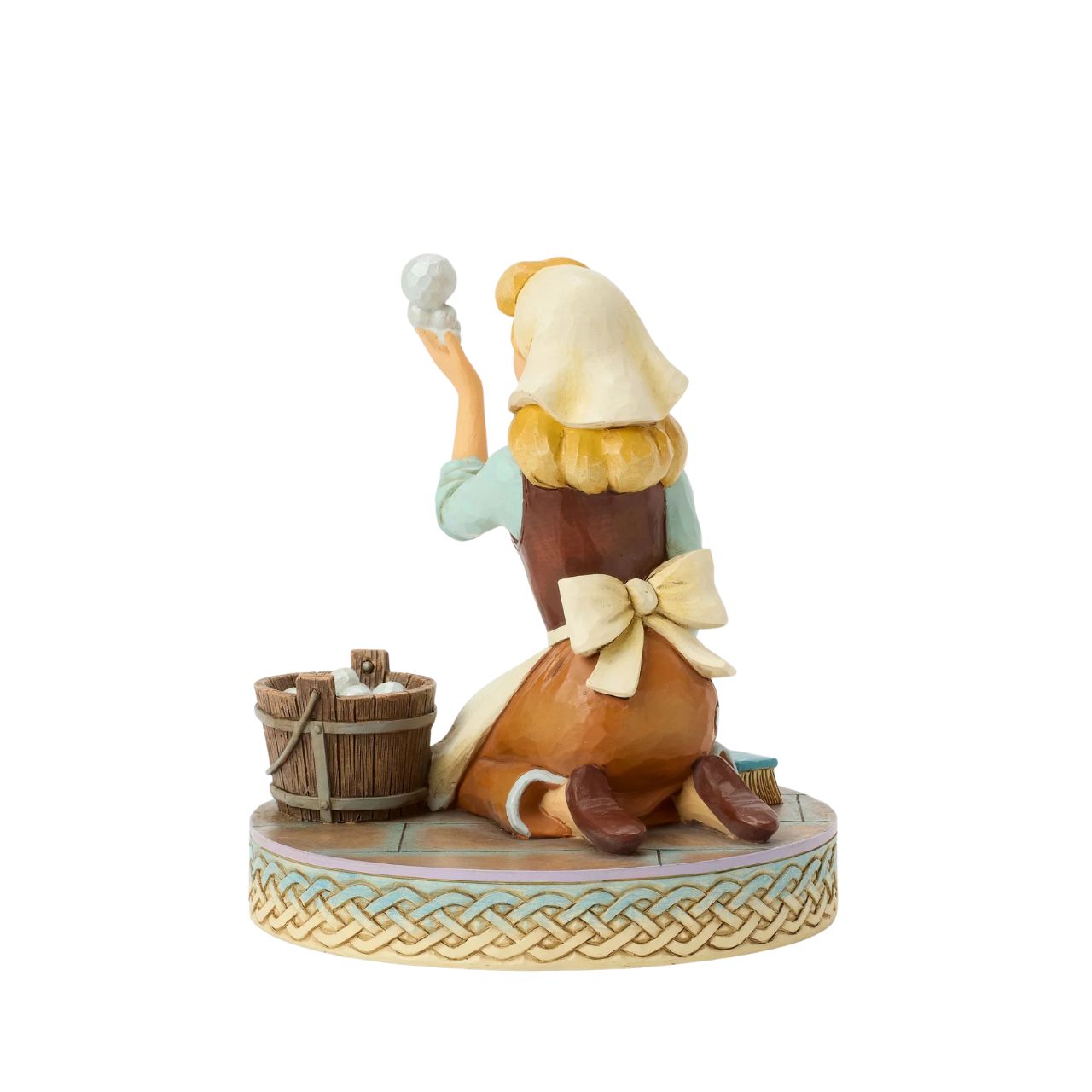 Cinderella's spirit remains unbroken in this inspiring Jim Shore scene. Dressed as a maid, she finds joy in her work, catching a bubble as she scrubs the floors. Jim Shore's enchanting details capture her beauty and resilience.