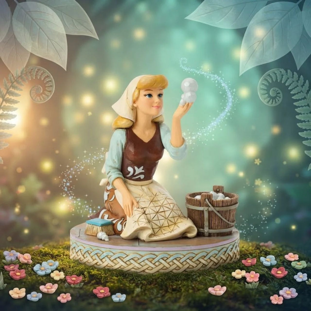 Cinderella's spirit remains unbroken in this inspiring Jim Shore scene. Dressed as a maid, she finds joy in her work, catching a bubble as she scrubs the floors. Jim Shore's enchanting details capture her beauty and resilience.