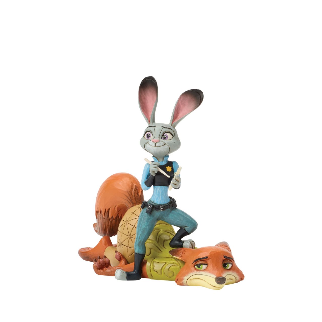 From Zootopia, Judy Hopps and Nick Wilde share a moment of playful teamwork in this Jim Shore reimagining. With bright folk art patterns and colourful detail, it celebrates friendship and playfulness. Judy stands ready to take notes, on top of Nick.