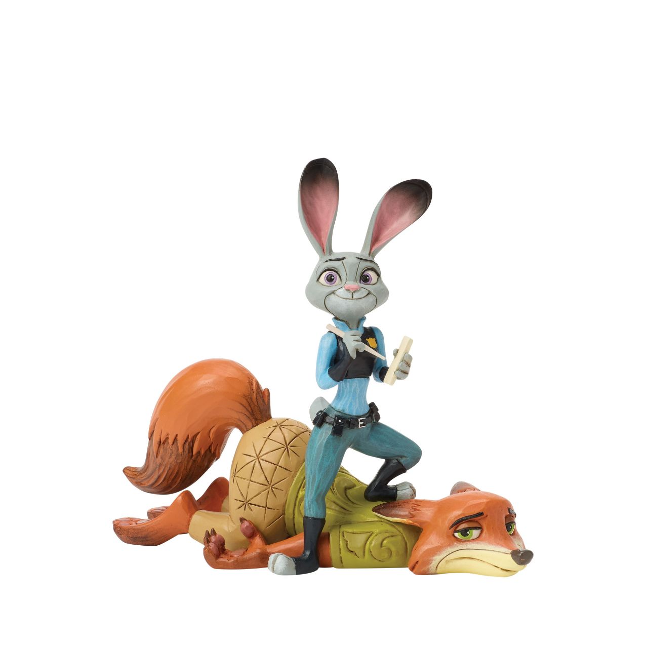 From Zootopia, Judy Hopps and Nick Wilde share a moment of playful teamwork in this Jim Shore reimagining. With bright folk art patterns and colourful detail, it celebrates friendship and playfulness. Judy stands ready to take notes, on top of Nick.